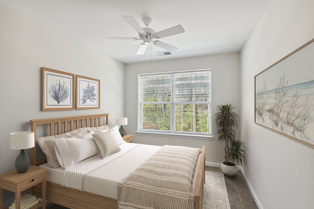 a bedroom with a bed and a ceiling fan
