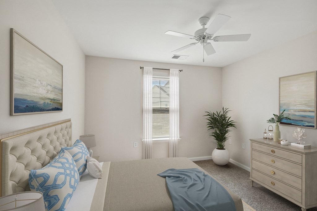 a bedroom with a bed and a dresser and a ceiling fan