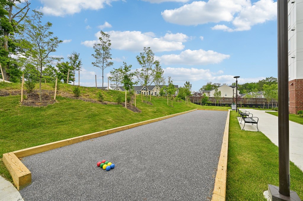 A playground with a rubberized surface and a yellow border.