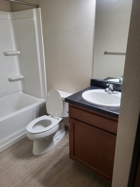 an empty bathroom with a toilet and a sink