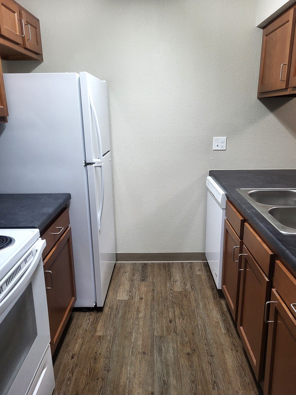 kitchen white fridge and stock with cabinets