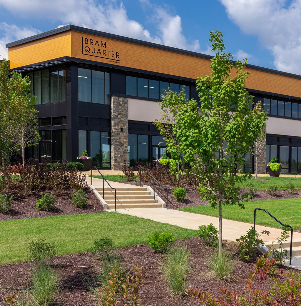 a large building with a tree in front of it