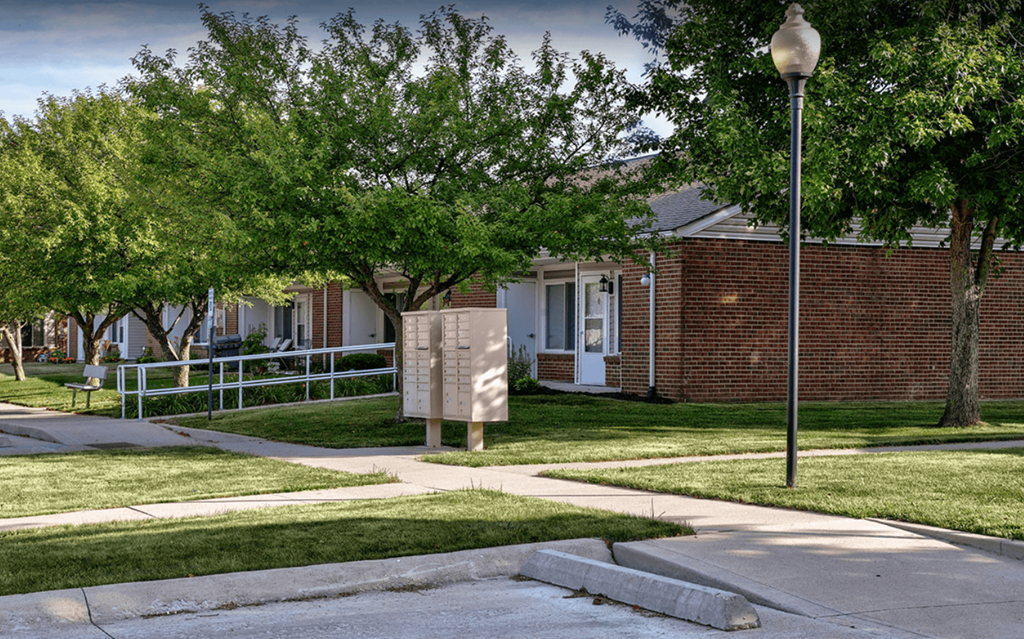 a sign in front of a brick building