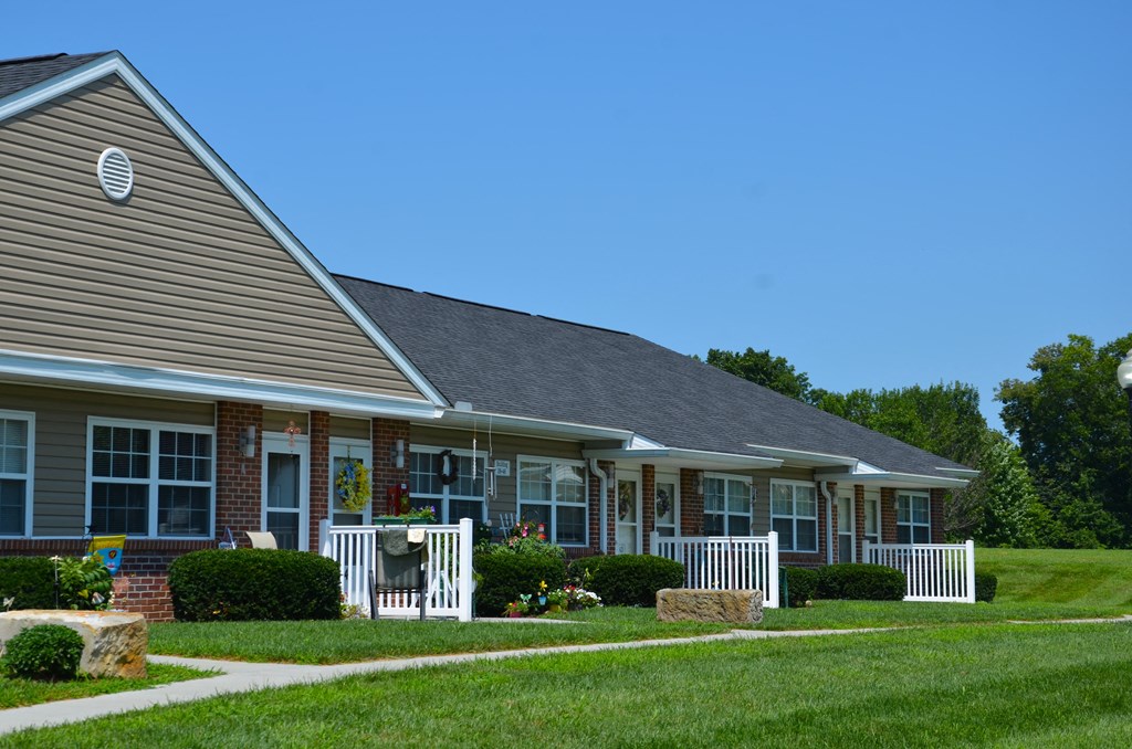 a house with a porch and a lawn