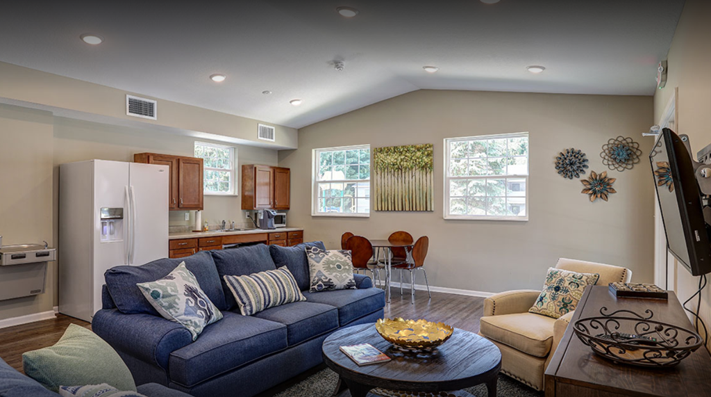 a living room with a couch and a table
