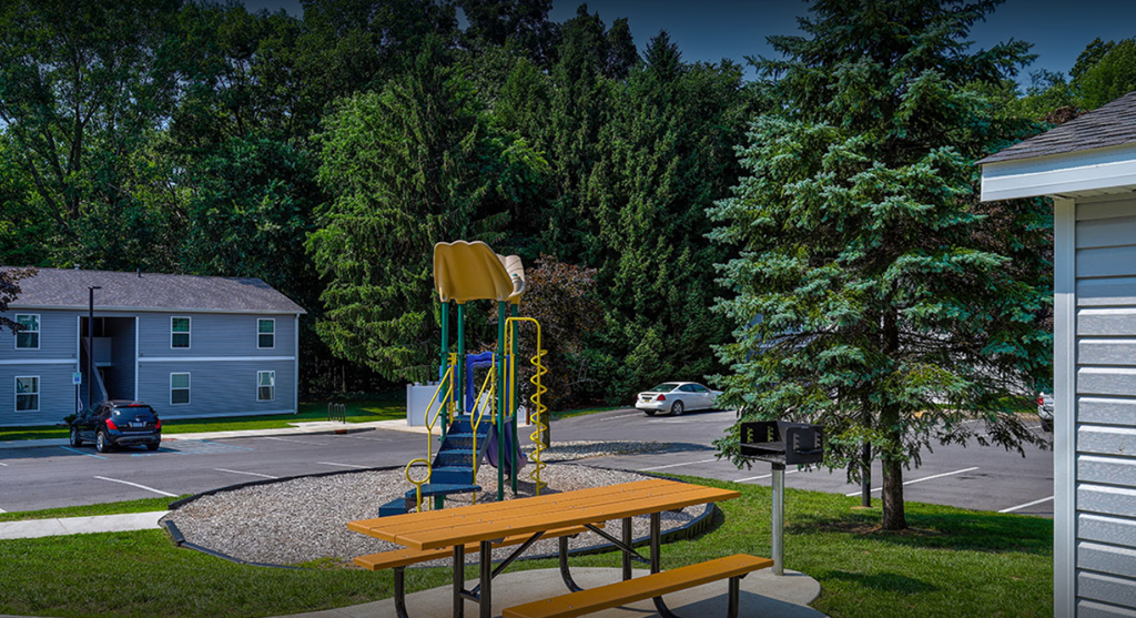 a playground with a picnic table