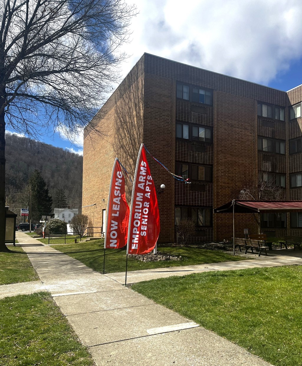 three red banners in front of a building