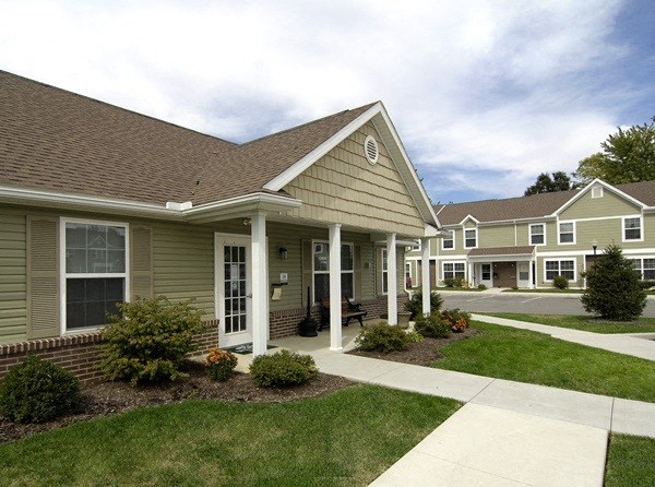 a house with a sidewalk in front of it