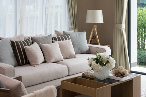 a living room with a white couch and a coffee table