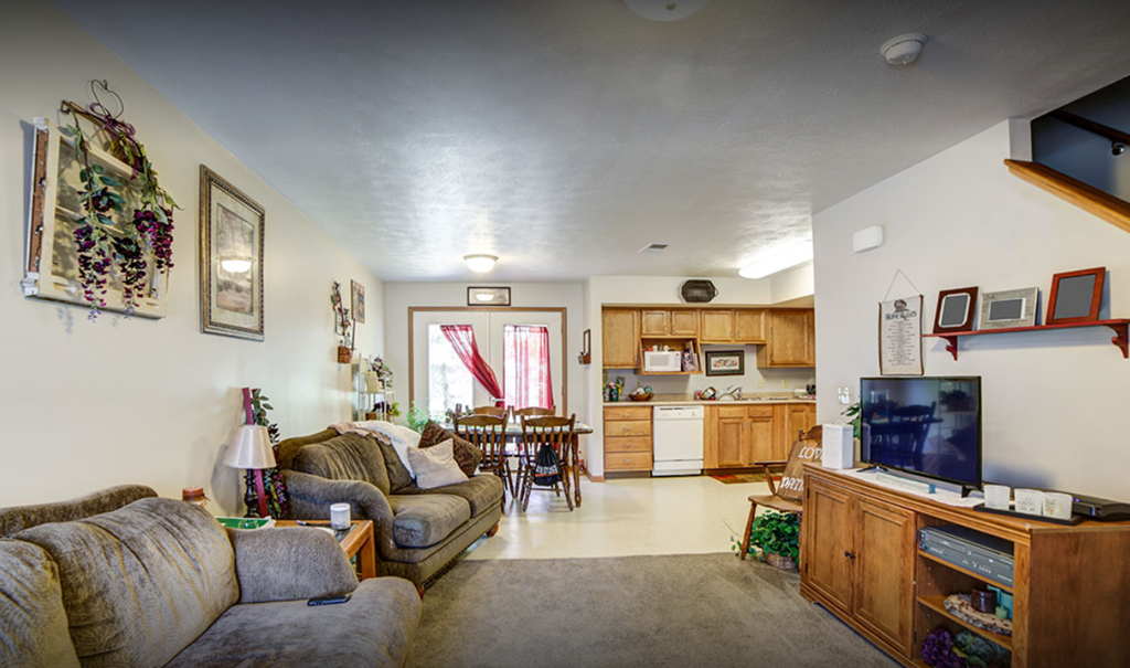 living room with couch and kitchen