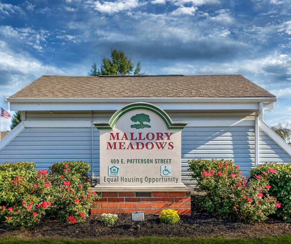 the mallory meadows sign on the front of a building