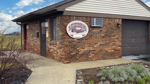 a brick building with a sign on the front of it