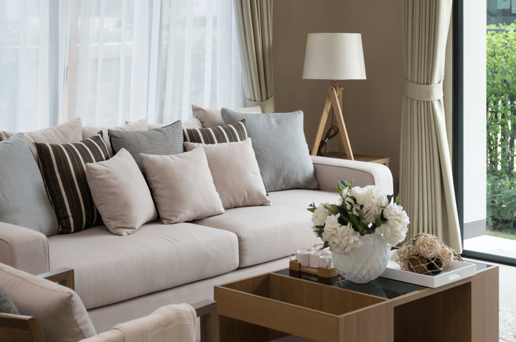 a living room with a white couch and a coffee table