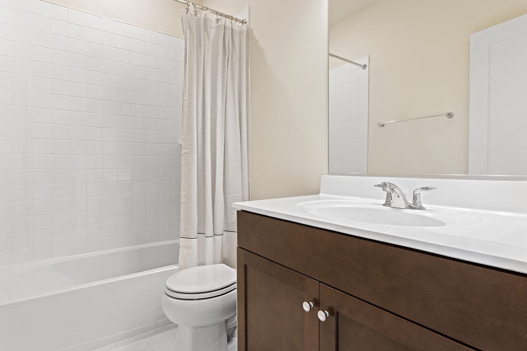 a bathroom with a toilet sink and bathtub