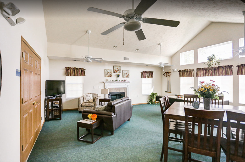 a living room and dining room with a couch and a table