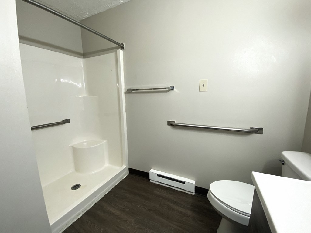 a small bathroom with a toilet and a shower