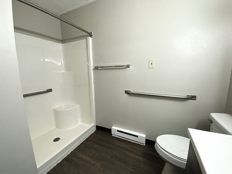 a small bathroom with a toilet and a shower