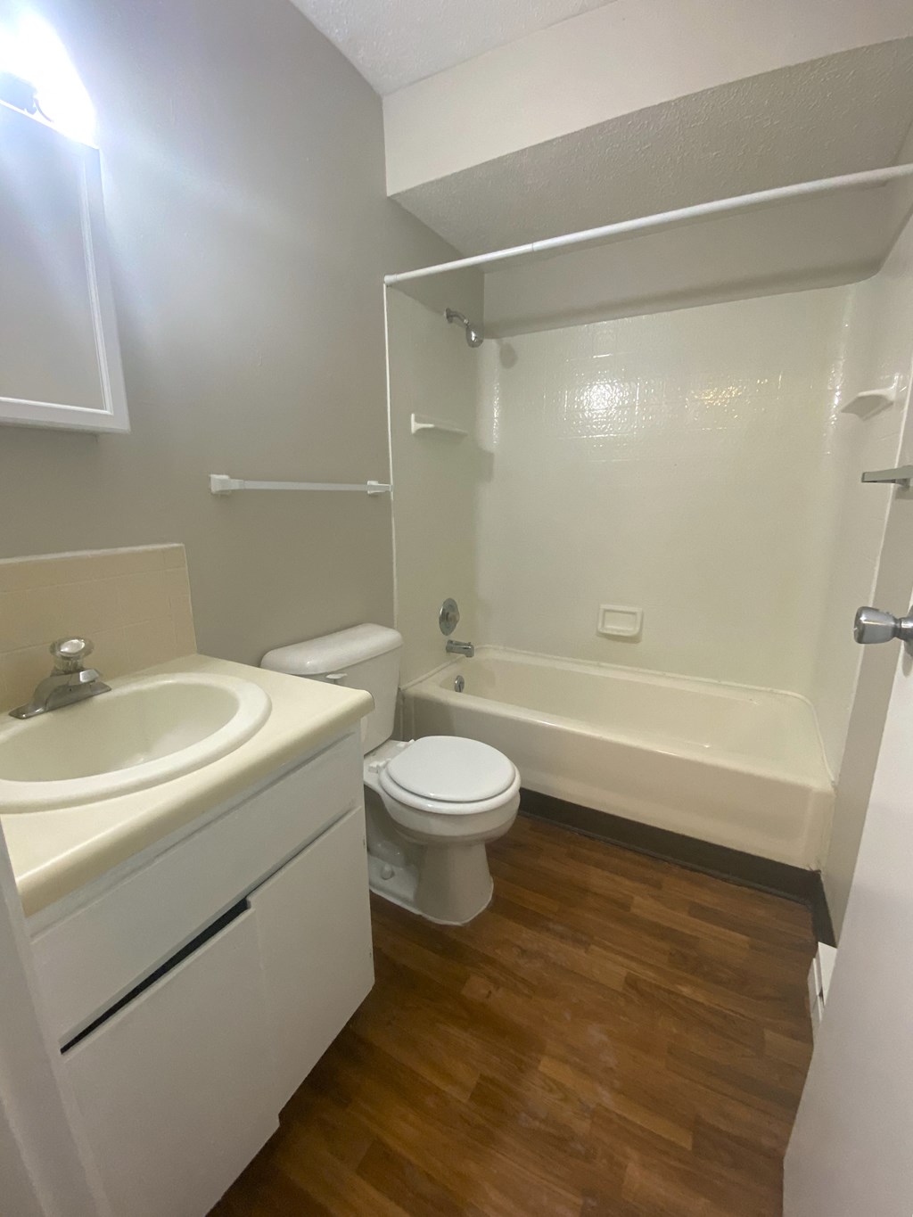 a bathroom with a sink toilet and a bath tub