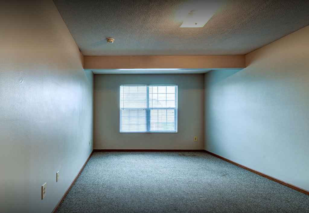 an empty room with a window in it
