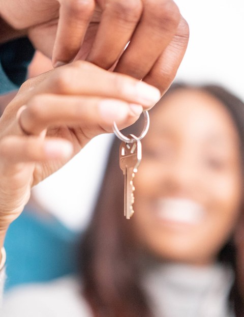A person is holding a bunch of keys.