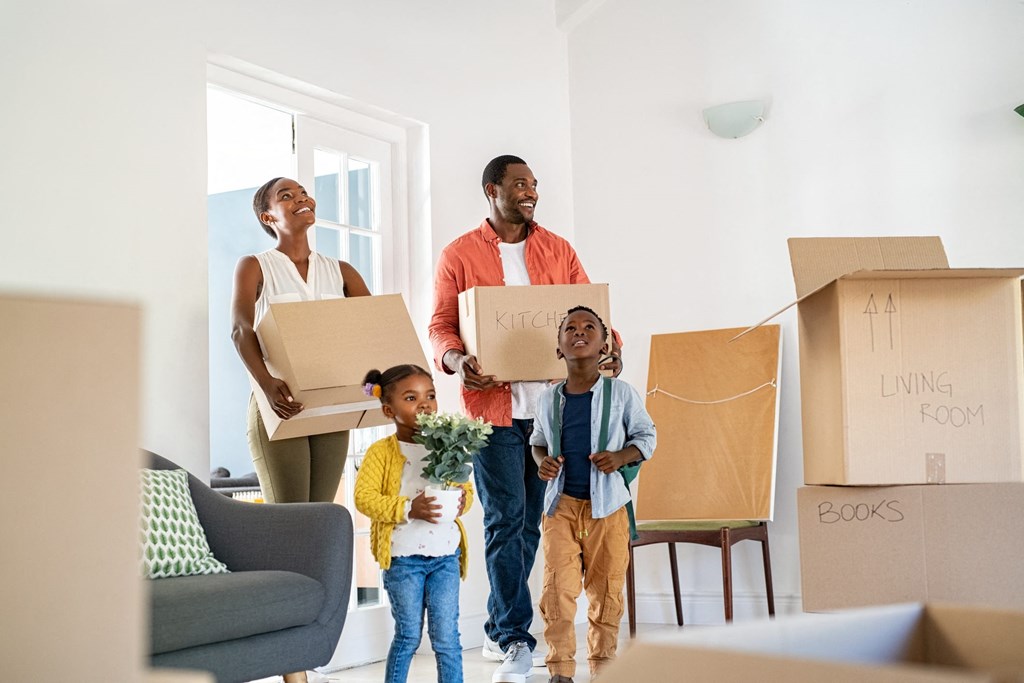 A family of four is moving into a new home.