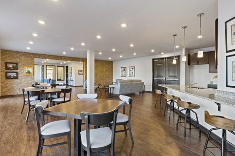 a restaurant with a bar and tables and chairs