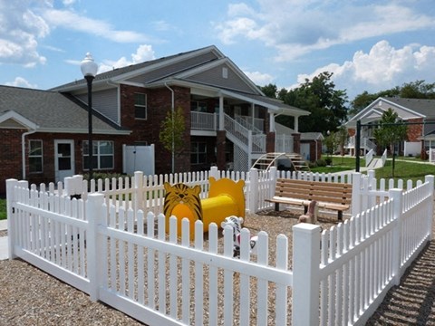 a white picket fence in front of a house