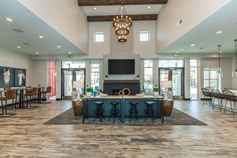 A large open space with a fireplace and bar area.