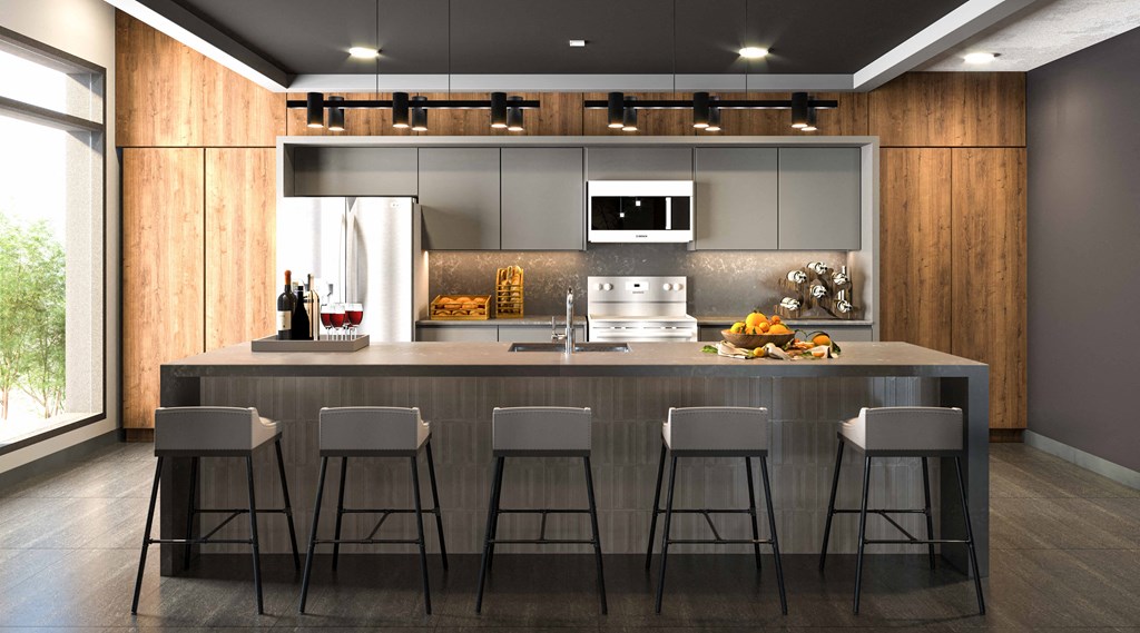 a kitchen with a large island with four bar stools