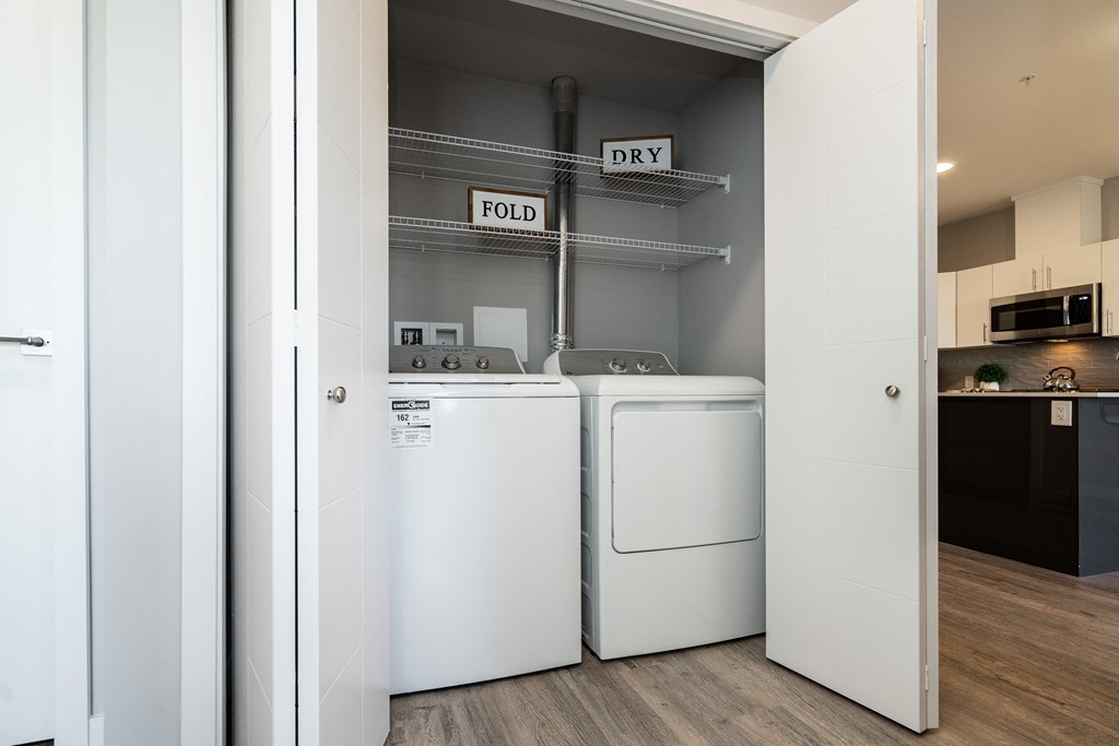 a laundry room with two washes and a dryer in it