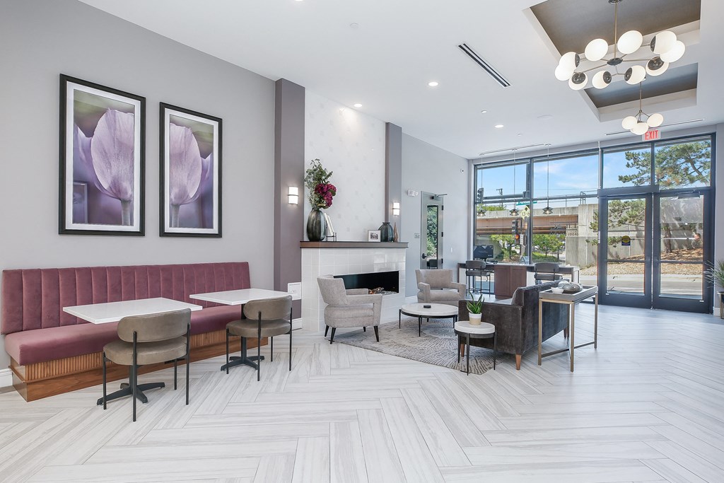 a seating area with couches chairs and tables