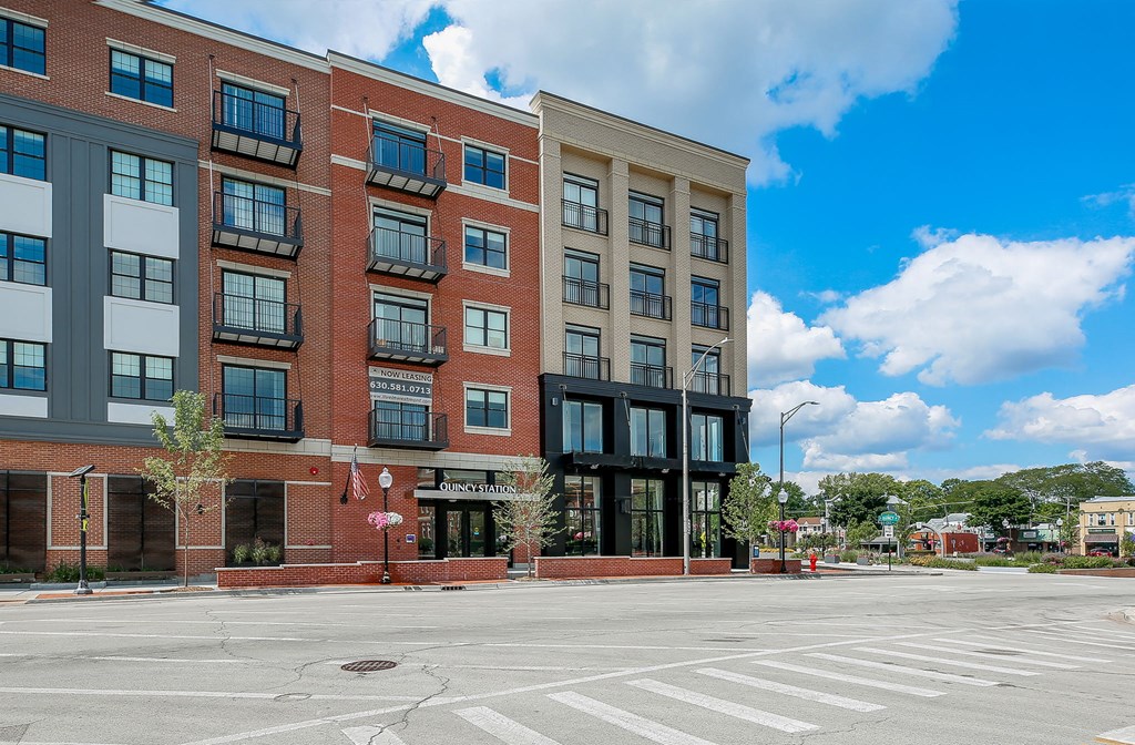 a large brick building on the corner of a street