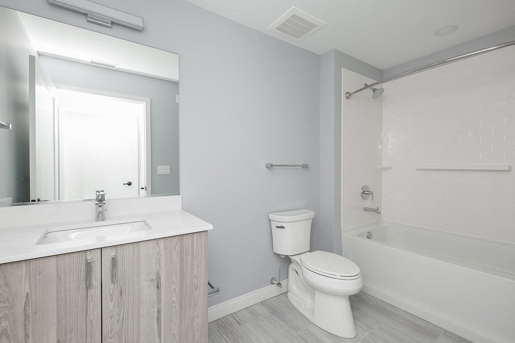 a bathroom with white sink and toilet