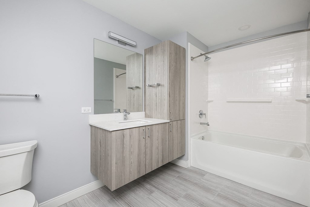 a bathroom with a sink and a bath tub