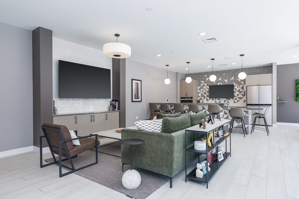a living room filled with furniture and a large flat screen tv
