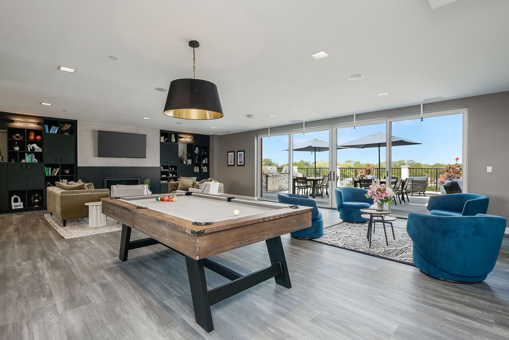 a clubhouse with a pool table and a tv