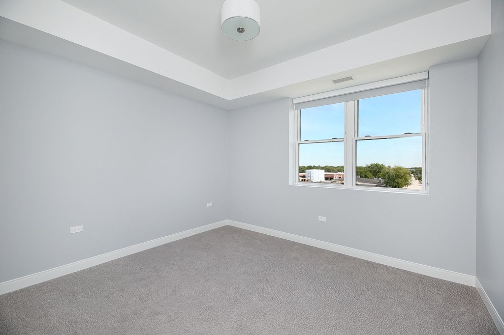 a bedroom with small window