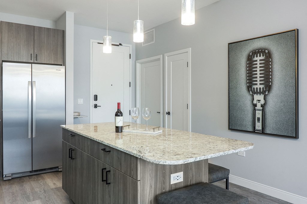 a kitchen with a counter top and a refrigerator