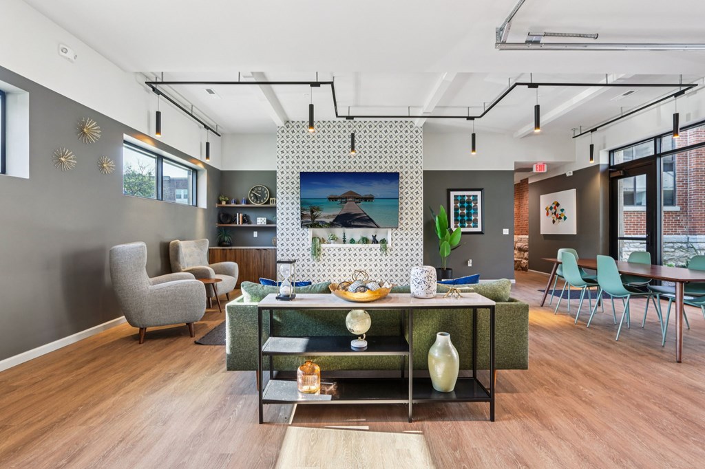 A modern dining room with a wooden table and chairs.