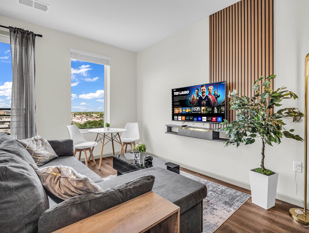 a living room with a couch and a tv