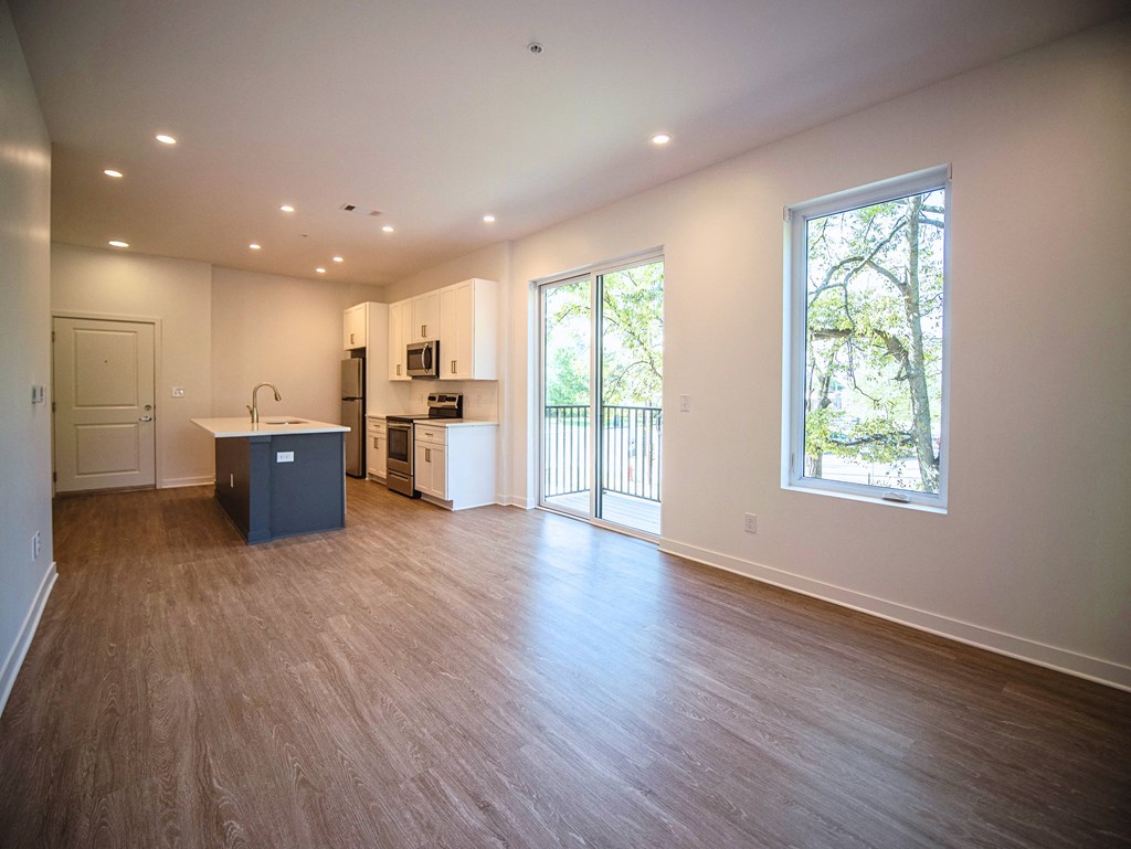 Large living room and kitchen with stainless steel appliances