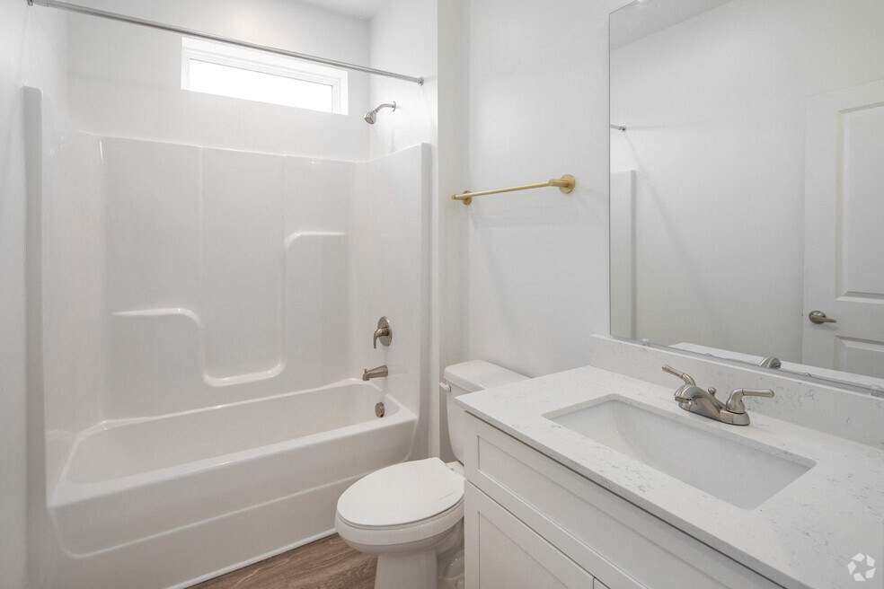 a bathroom with a sink toilet and a shower