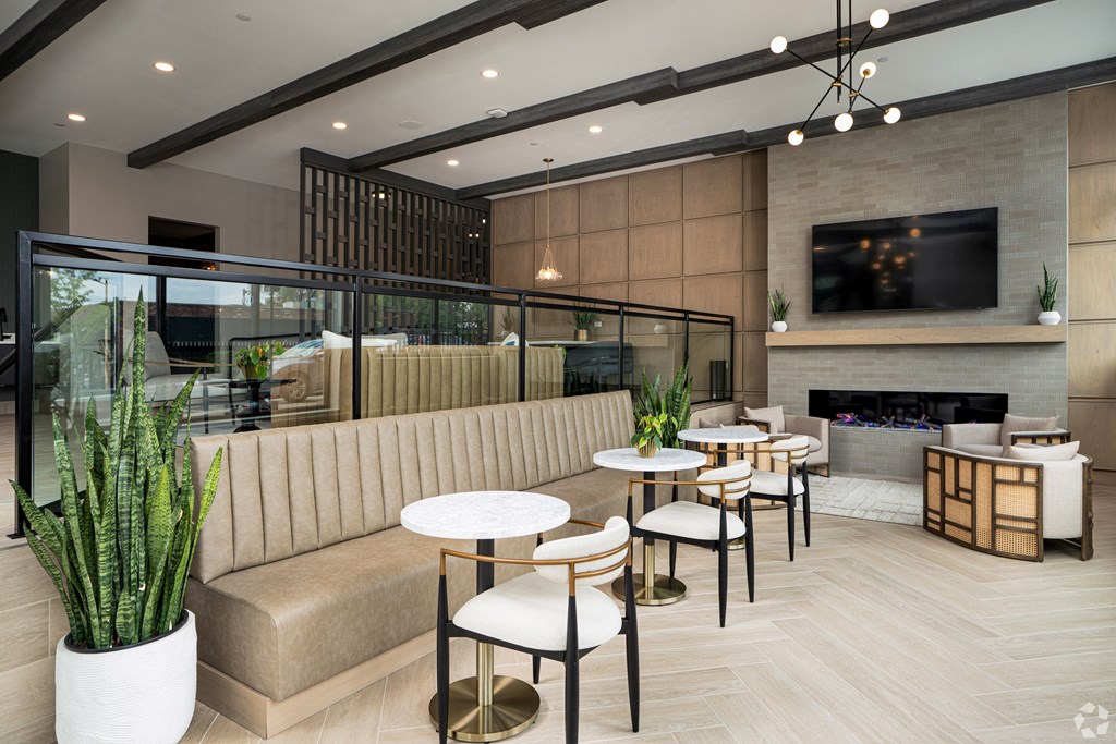 A modern living room with a fireplace and a television.
