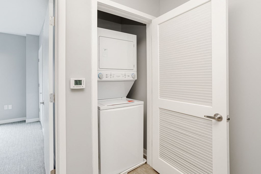 a small laundry room with a washer and dryer in a closet