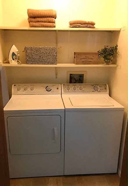 a white washer and dryer in a laundry room