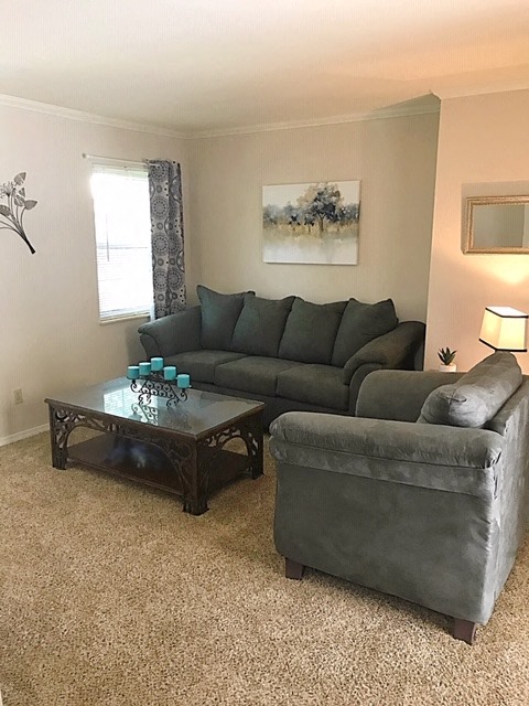a living room with a couch and a table