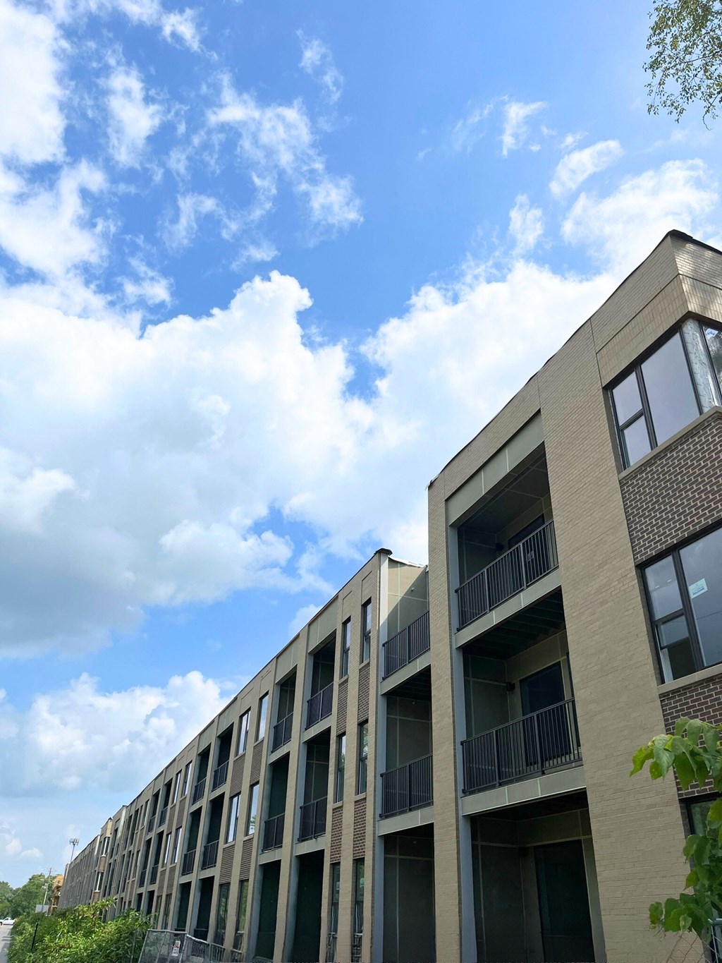 a picture of a building with a blue sky in the background
