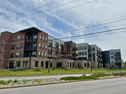 A large apartment complex with multiple buildings and balconies.