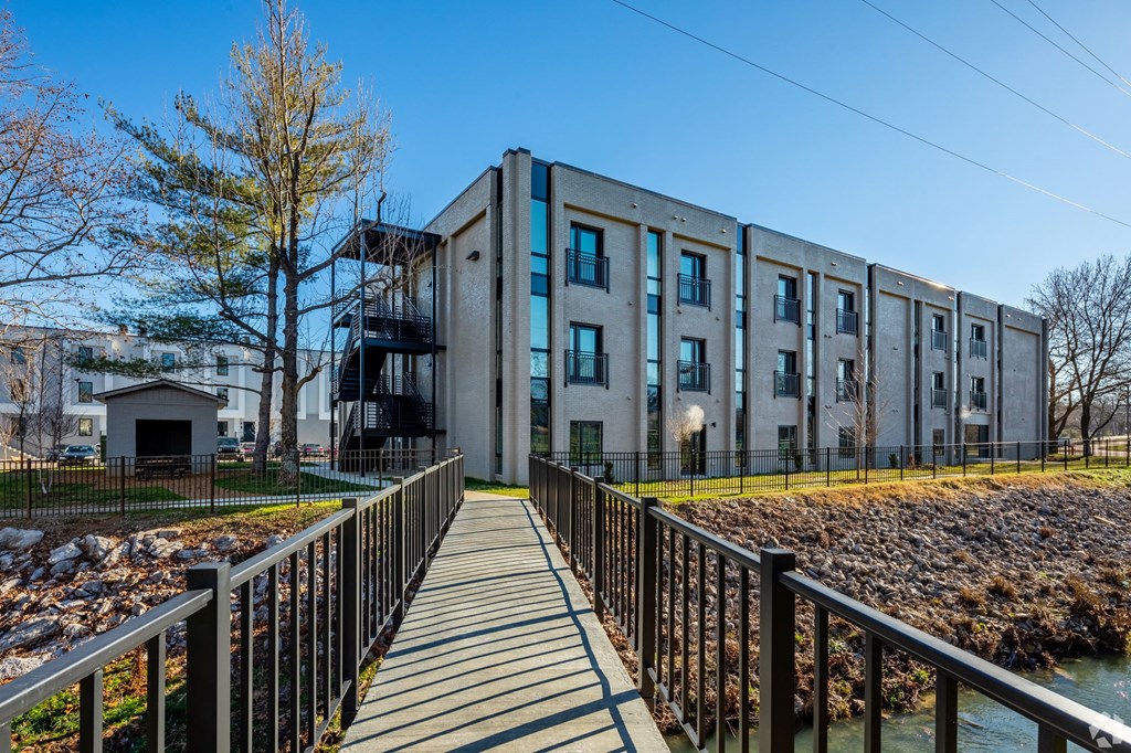 a large building with a bridge in front of it