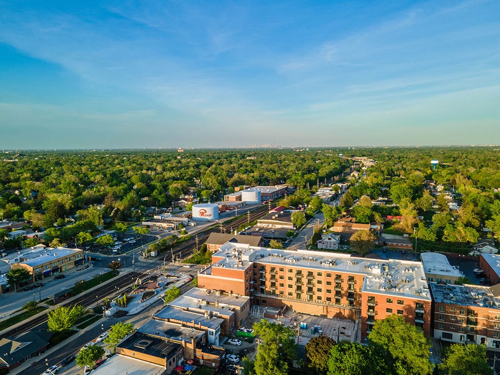 an aerial view of a city with buildings and trees